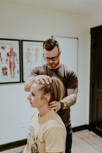 Dr. David Dalgardno providing hands-on chiropractic care