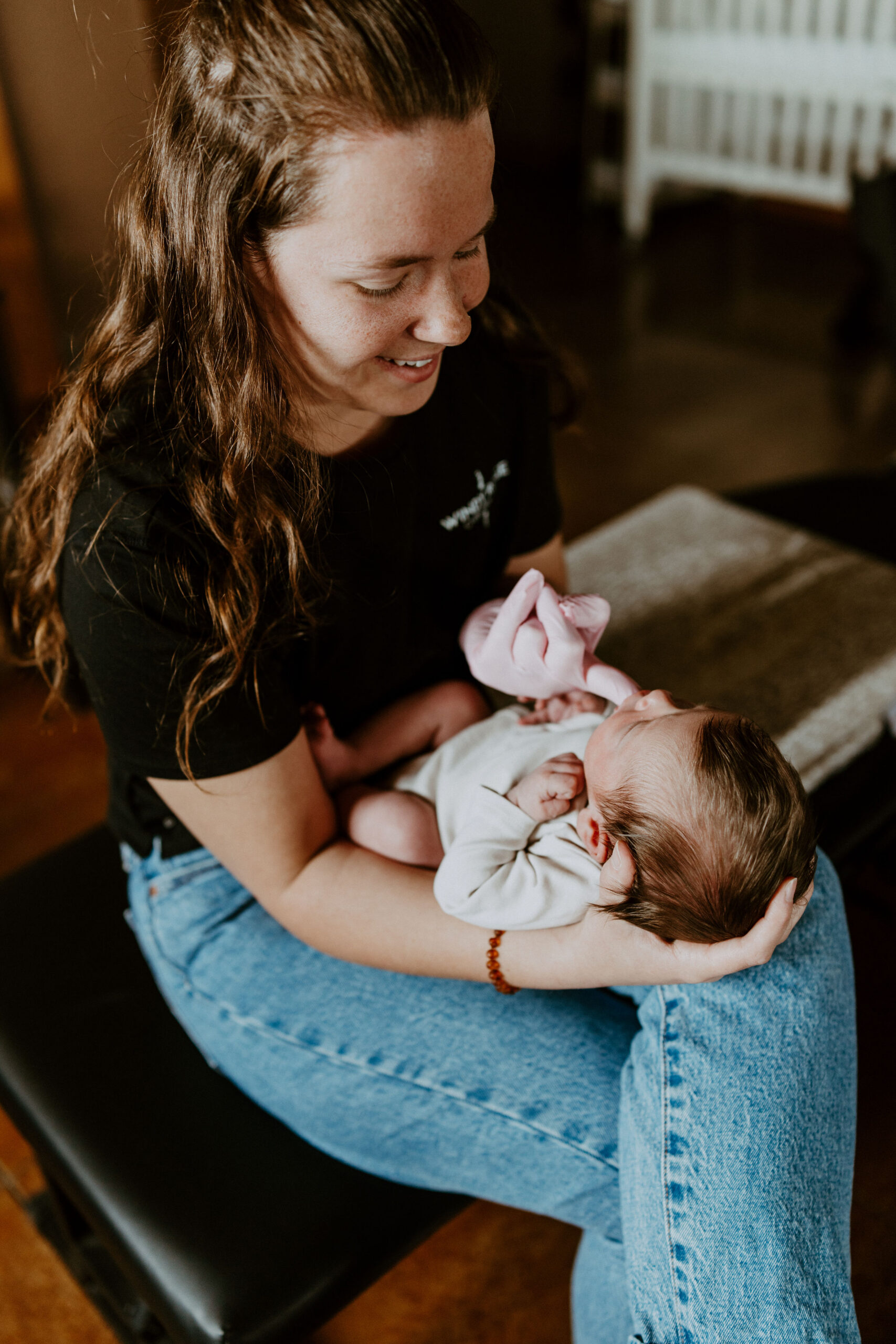 Dr. Claire Schauf speaking with a family during a pediatric chiropractic visit