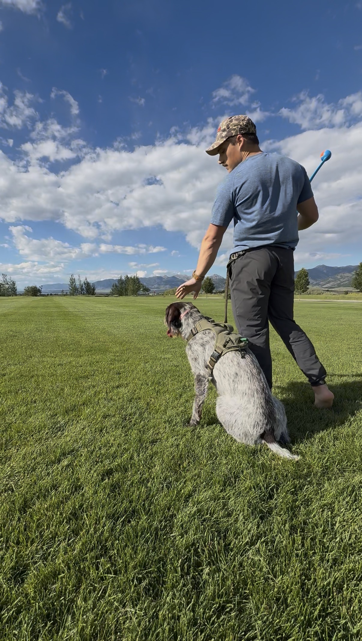 Dr. Kyle DeLamielleure training outdoors with his dog Hank in Montana