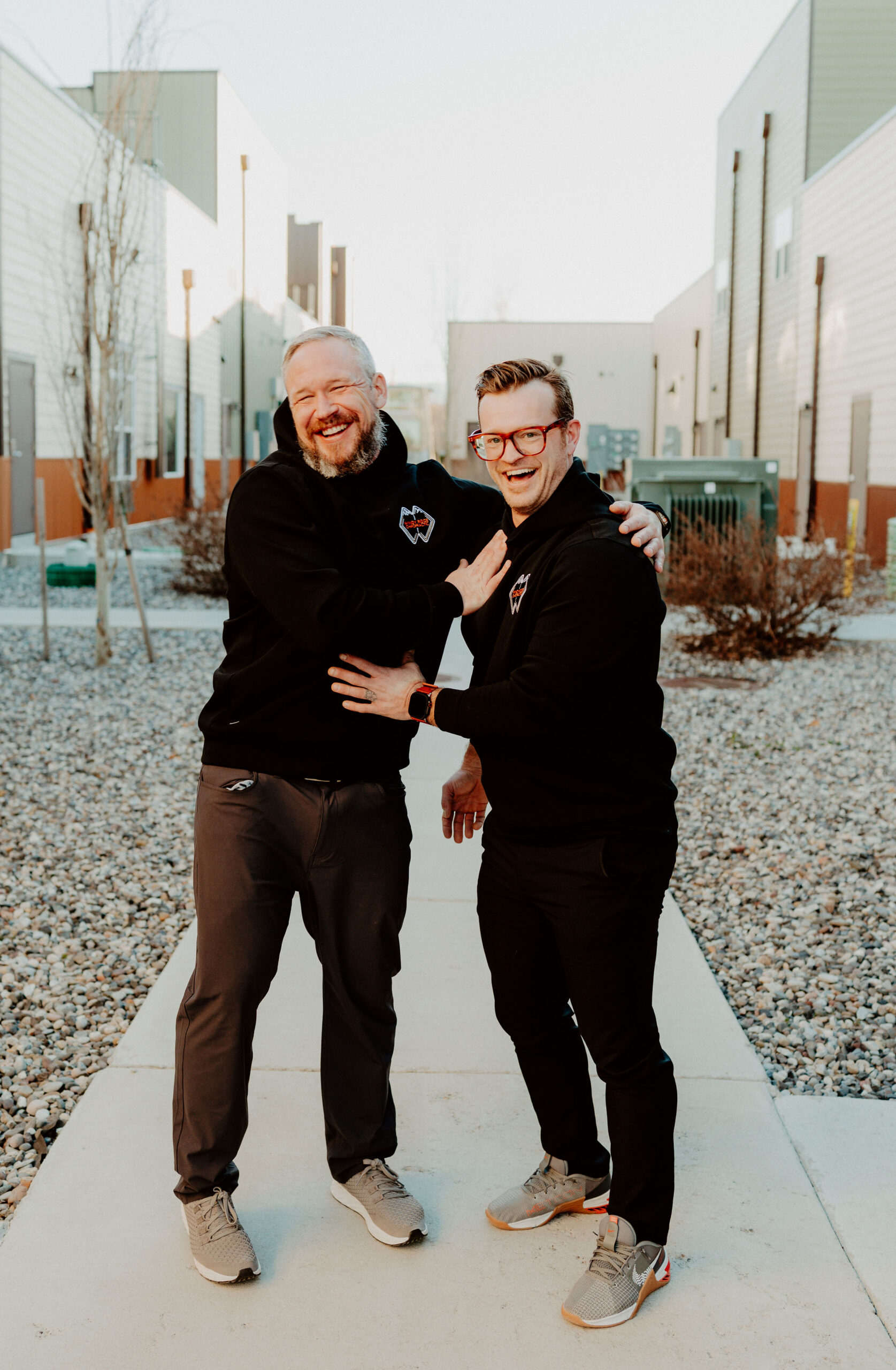 Dr. Josh Prange and Dr. David Dalgardno sharing a light moment during a Windy Ridge Chiropractic photo shoot