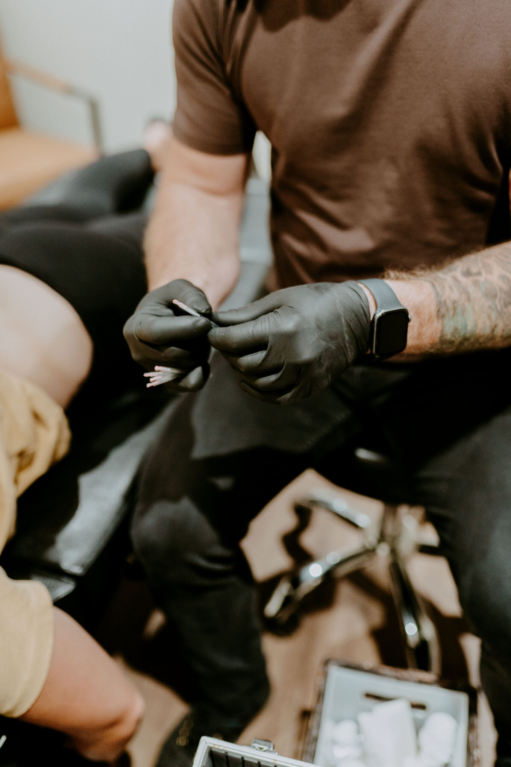 Clinician preparing fine needles for dry needling therapy