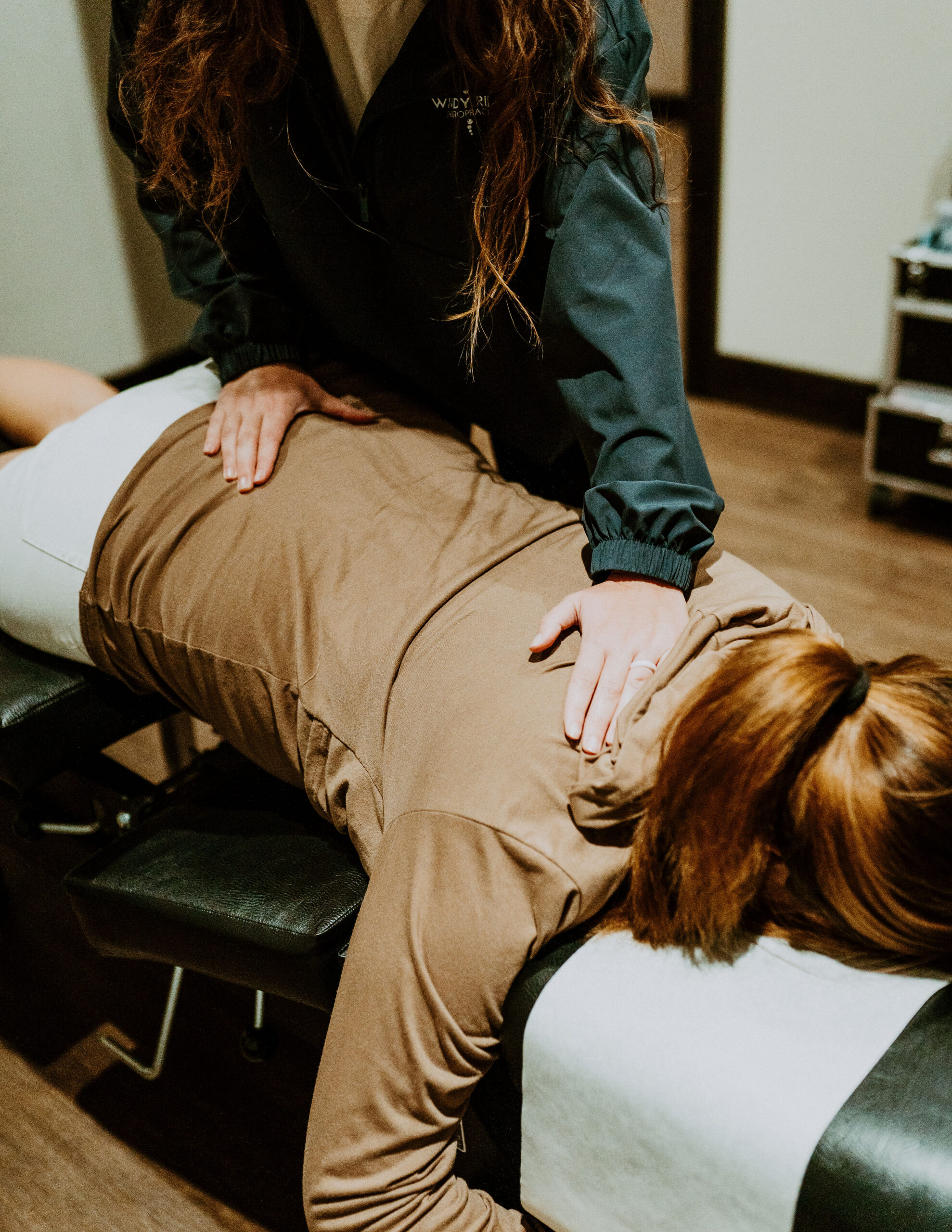 Dr. Claire Schauf discussing pregnancy chiropractic care with a patient