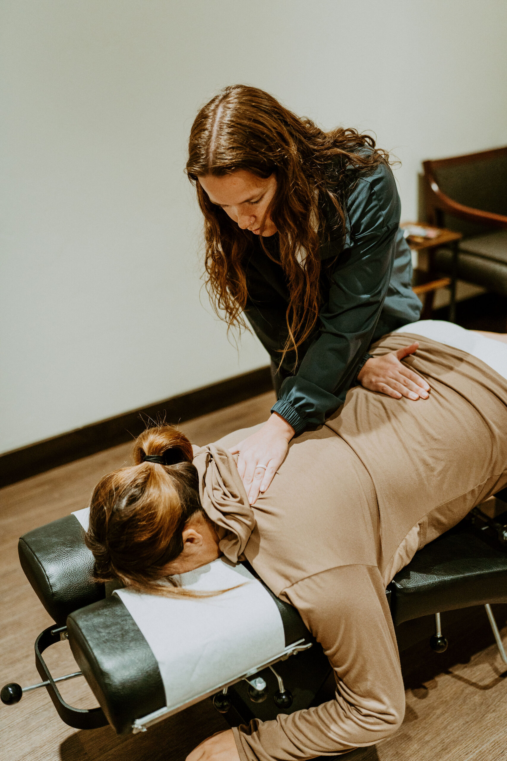 Comfortable positioning during a pregnancy chiropractic visit with Dr. Claire Schauf